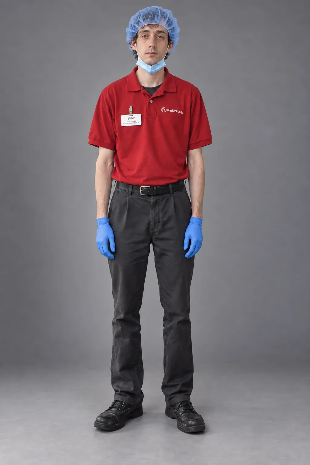 Young employee in a red RadioShack polo, surgical cap, blue gloves, and a lowered mask.